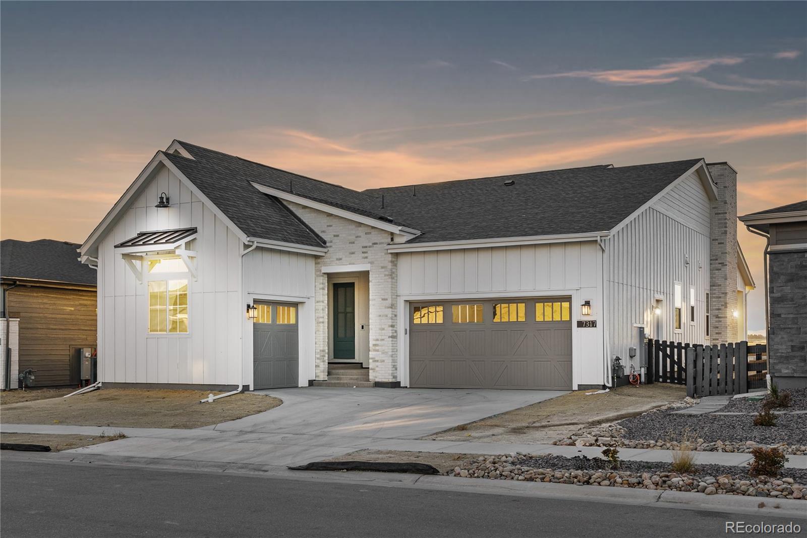 a view of garage with wooden floor and door