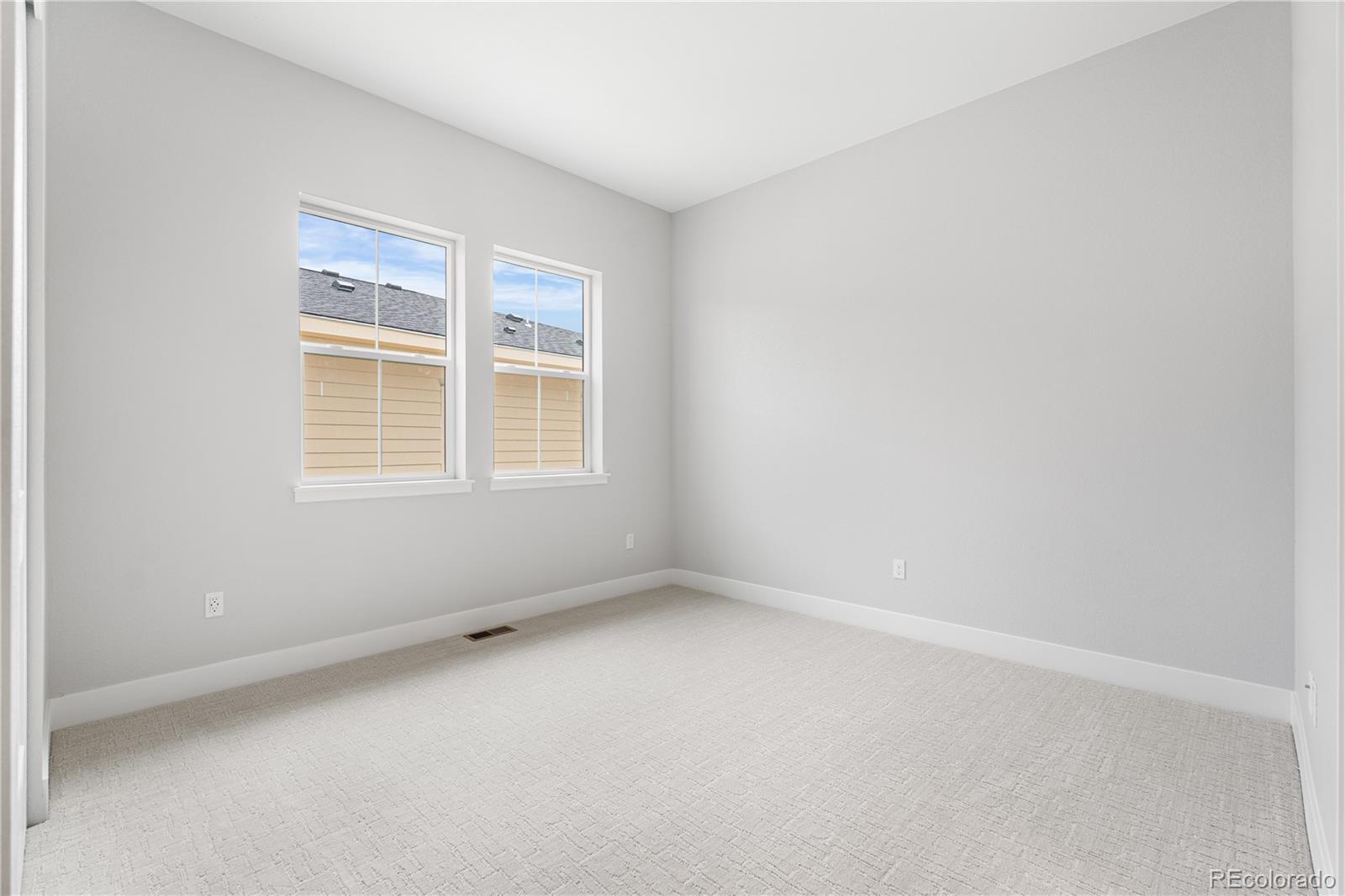 7317 Timberstone Street Castle Pines, CO 80108 - Photo 17 of 49 an empty room with a window