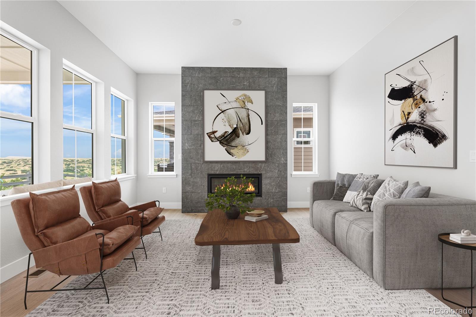 7317 Timberstone Street Castle Pines, CO 80108 - Photo 19 of 49 a living room with furniture a fireplace and a large window