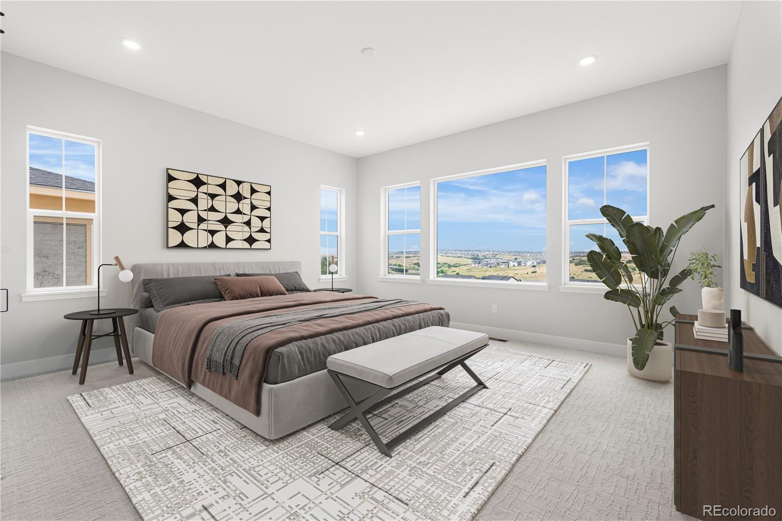 7317 Timberstone Street Castle Pines, CO 80108 - Photo 29 of 49 a spacious bedroom with a large bed and a potted plant