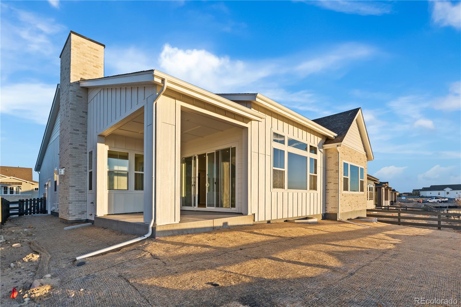 7317 Timberstone Street Castle Pines, CO 80108 - Photo 3 of 49 a view of a house with a backyard