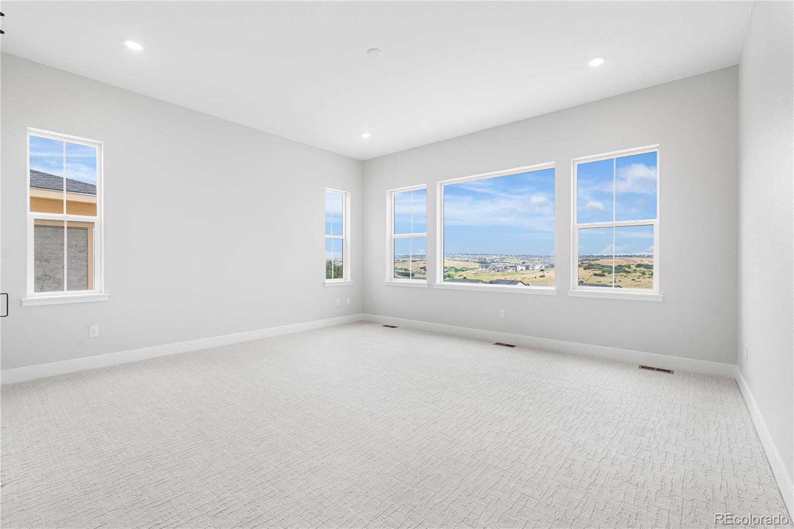 7317 Timberstone Street Castle Pines, CO 80108 - Photo 36 of 49 an empty room with windows