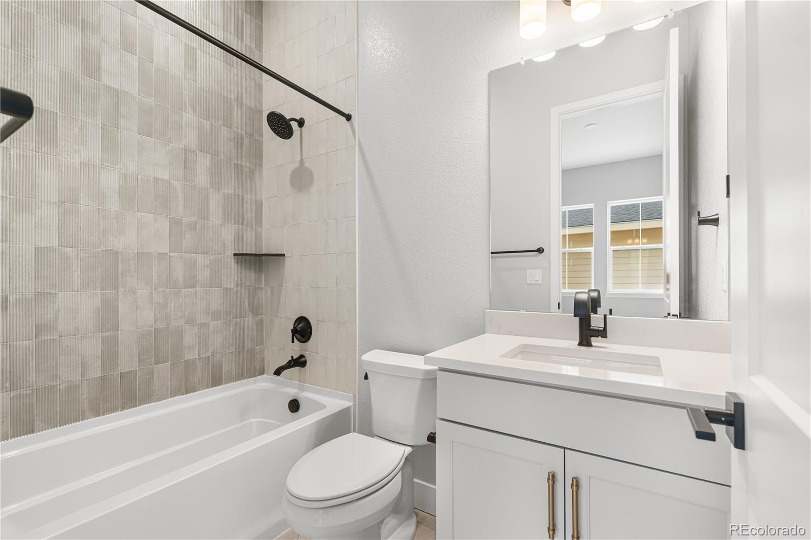 7317 Timberstone Street Castle Pines, CO 80108 - Photo 41 of 49 a bathroom with a sink a toilet and shower