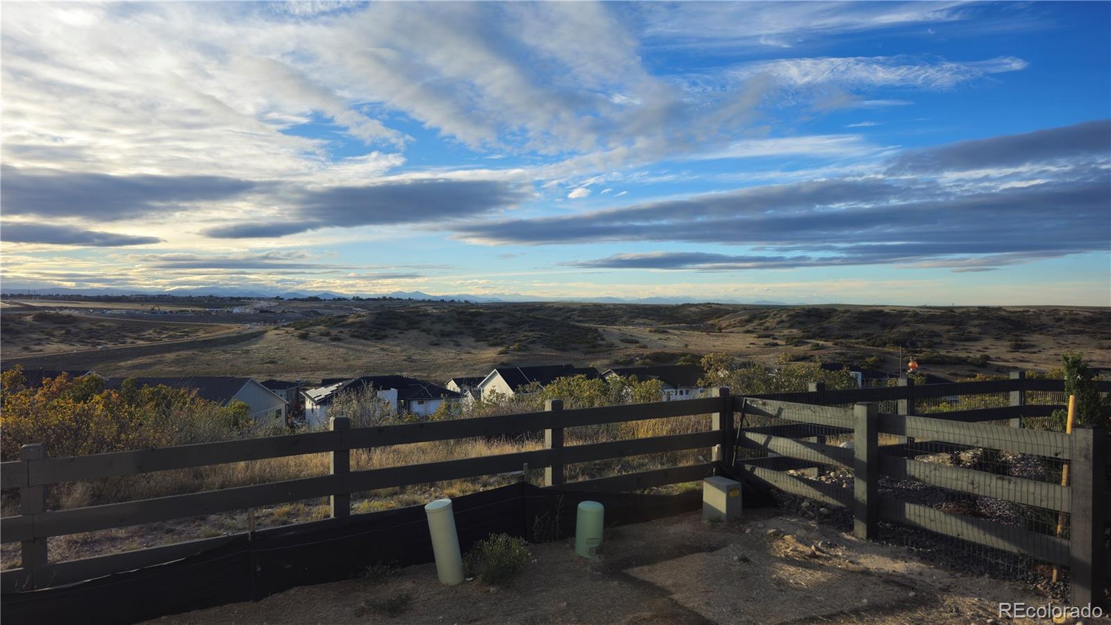 7317 Timberstone Street Castle Pines, CO 80108 - Photo 46 of 49 a view of a lake