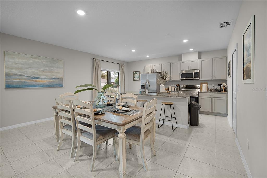 418 Fleming Street Sebastian, FL 32958 - Photo 6 of 38 a kitchen with a table and chairs in it