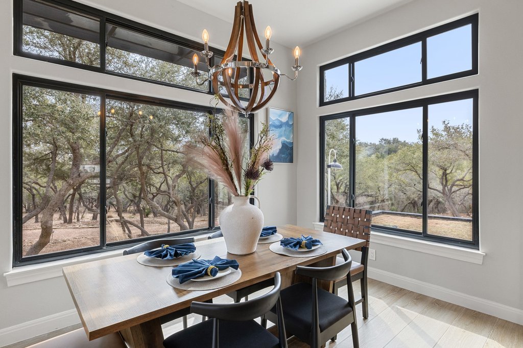 4018 Bee Creek Road Spicewood, TX 78669 - Photo 25 of 40 charming dining area off the kitchen with beautiful statement lighting.