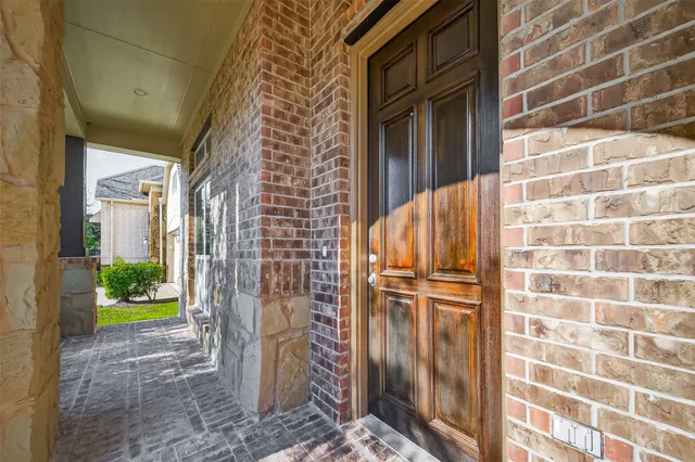 a kitchen with stainless steel appliances granite countertop a stove and a wooden floors