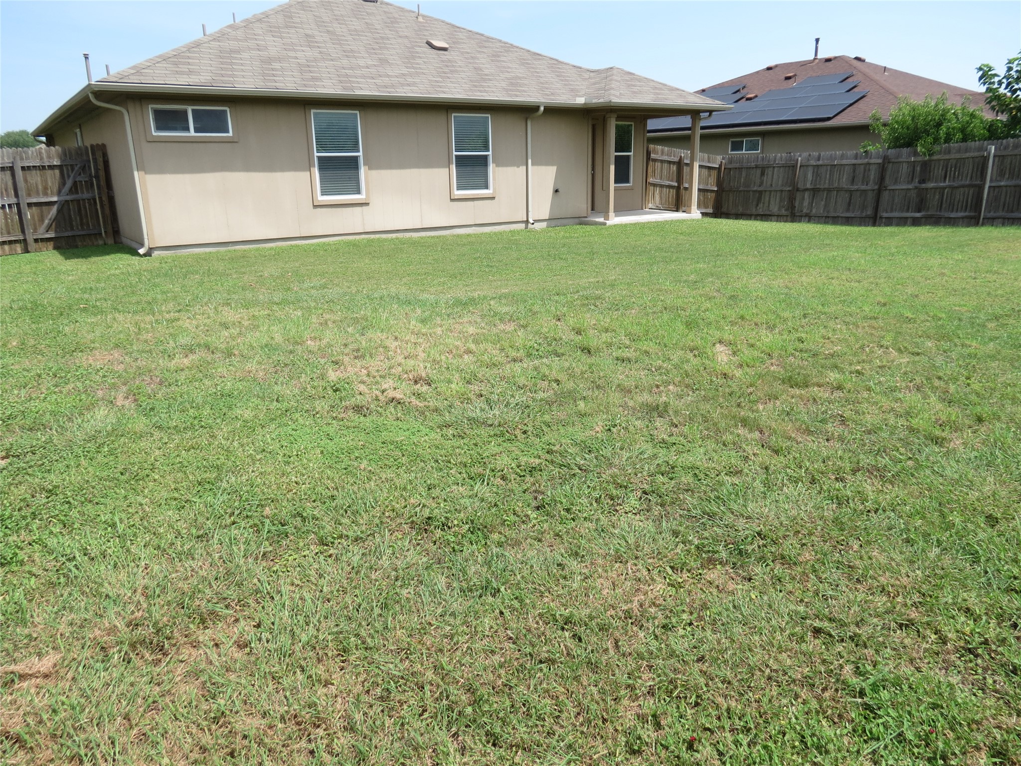 375 Musgrav Kyle, TX 78640 - Photo 24 of 31 A large fenced backyard offers a outdoor space for relaxation and activities.