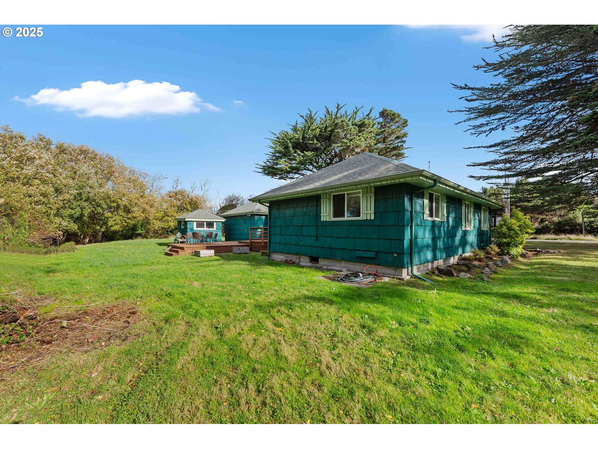 54568 Beach Loop Road Bandon, OR 97411 - Photo 19 of 38 a view of a house with backyard