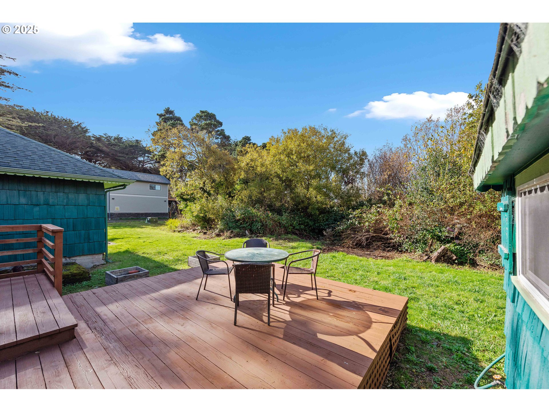 54568 Beach Loop Road Bandon, OR 97411 - Photo 23 of 38 a view of a backyard with sitting area