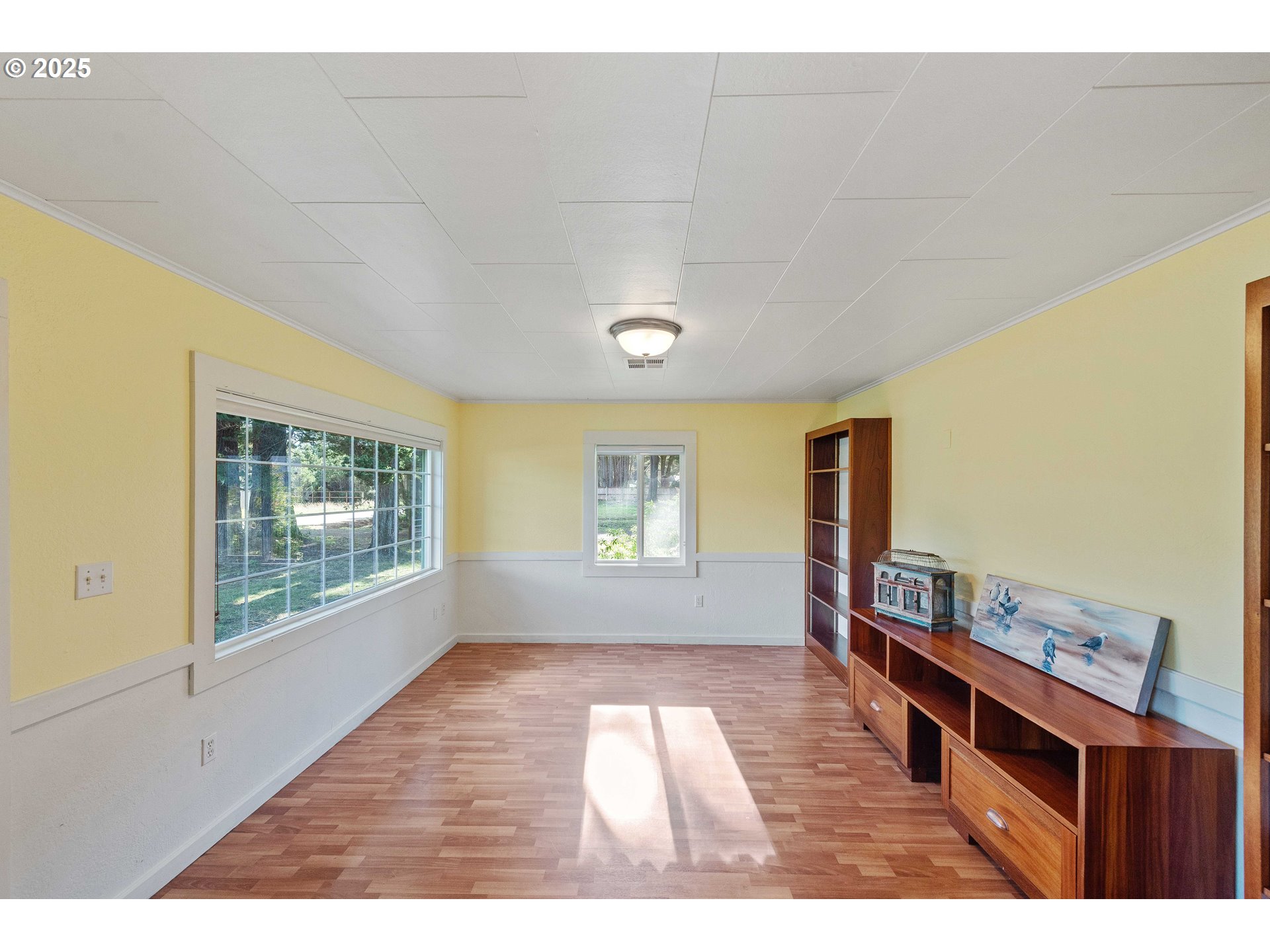 54568 Beach Loop Road Bandon, OR 97411 - Photo 24 of 38 a view of an empty room with wooden floor and a window