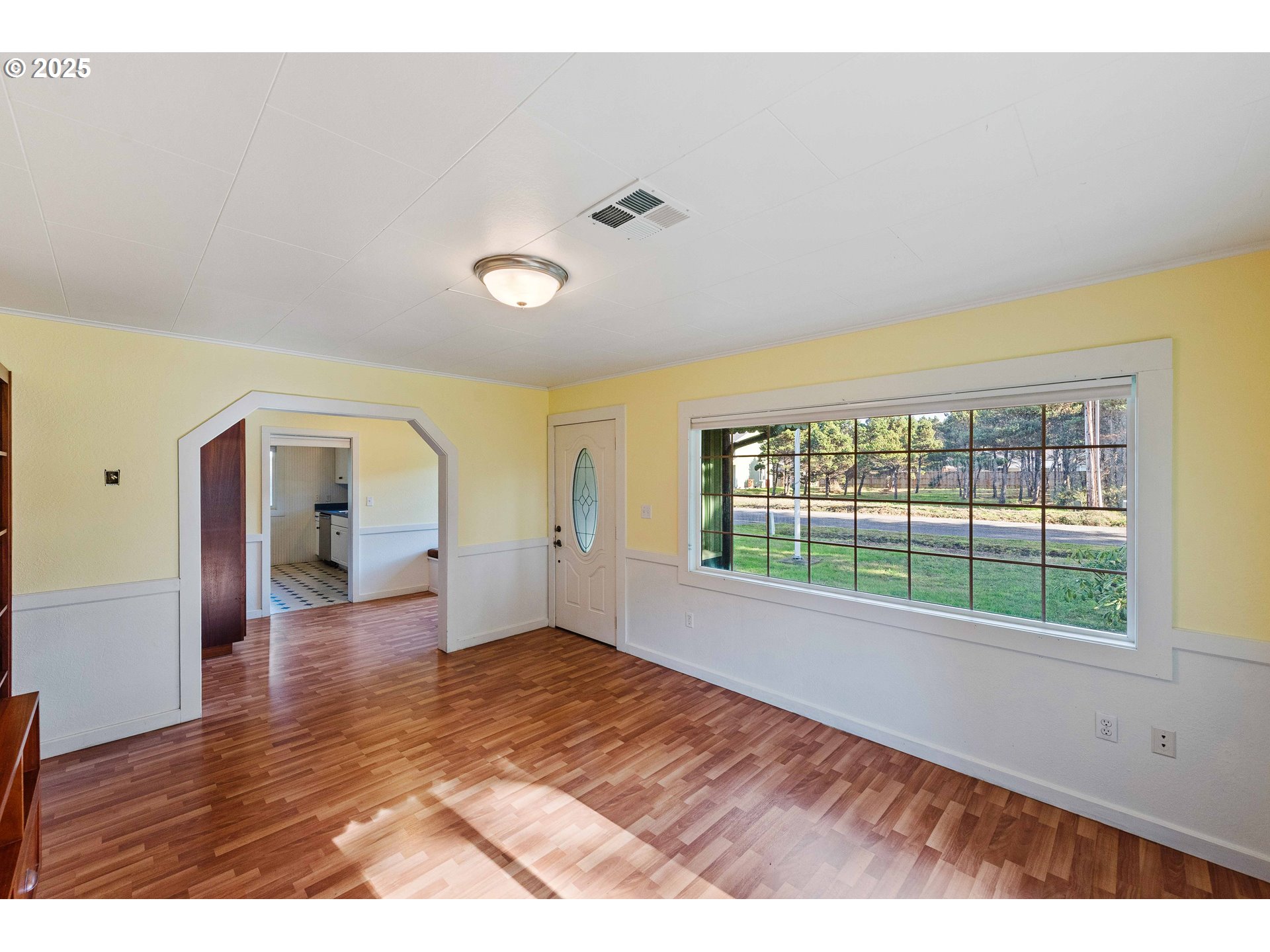 54568 Beach Loop Road Bandon, OR 97411 - Photo 25 of 38 a view of empty room with wooden floor and fan