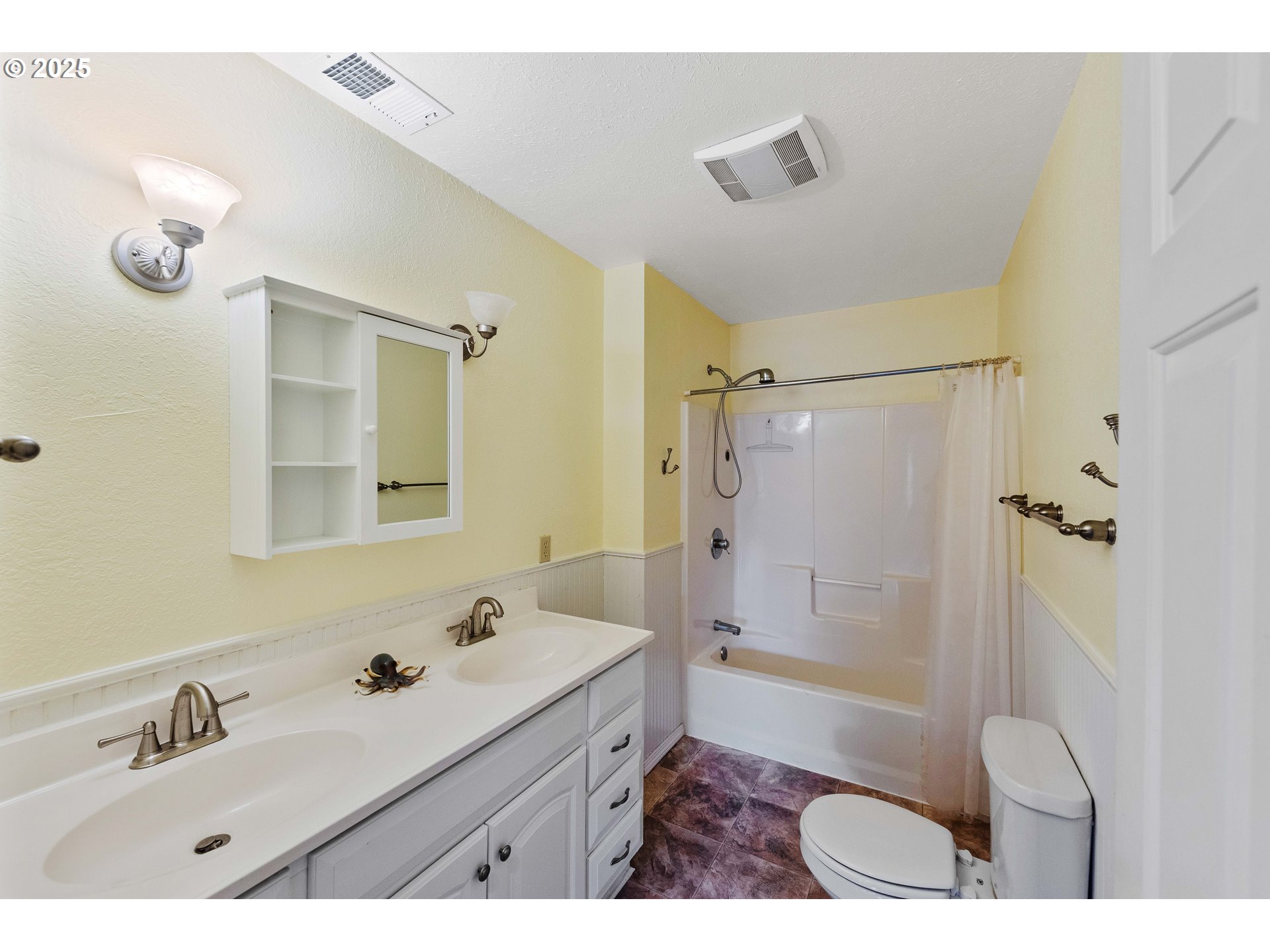 54568 Beach Loop Road Bandon, OR 97411 - Photo 33 of 38 a bathroom with a sink a toilet a mirror and shower