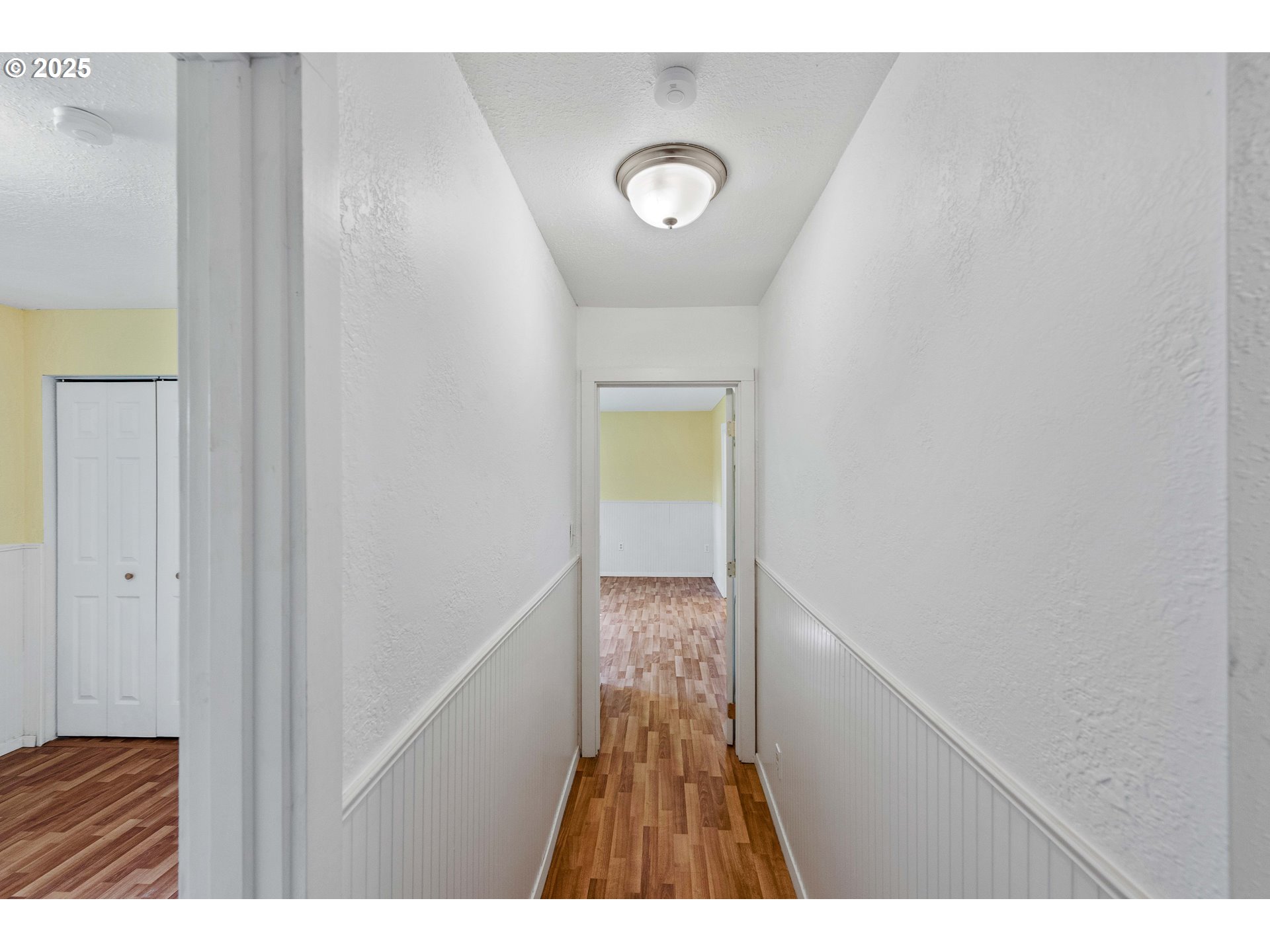 54568 Beach Loop Road Bandon, OR 97411 - Photo 36 of 38 a view of hallway with wooden floor