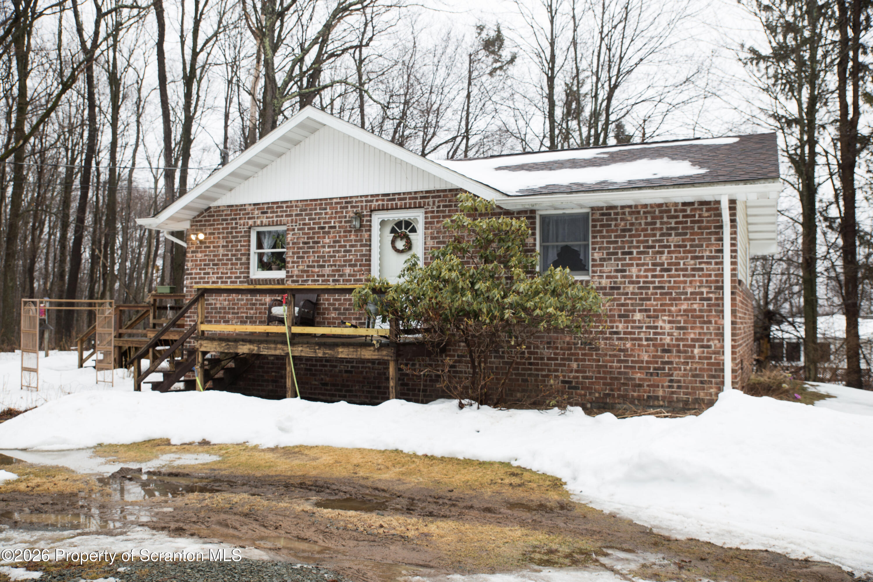 5411 Bloomington Road Moscow, PA 18444 - Photo 1 of 7 front view of house with a yard