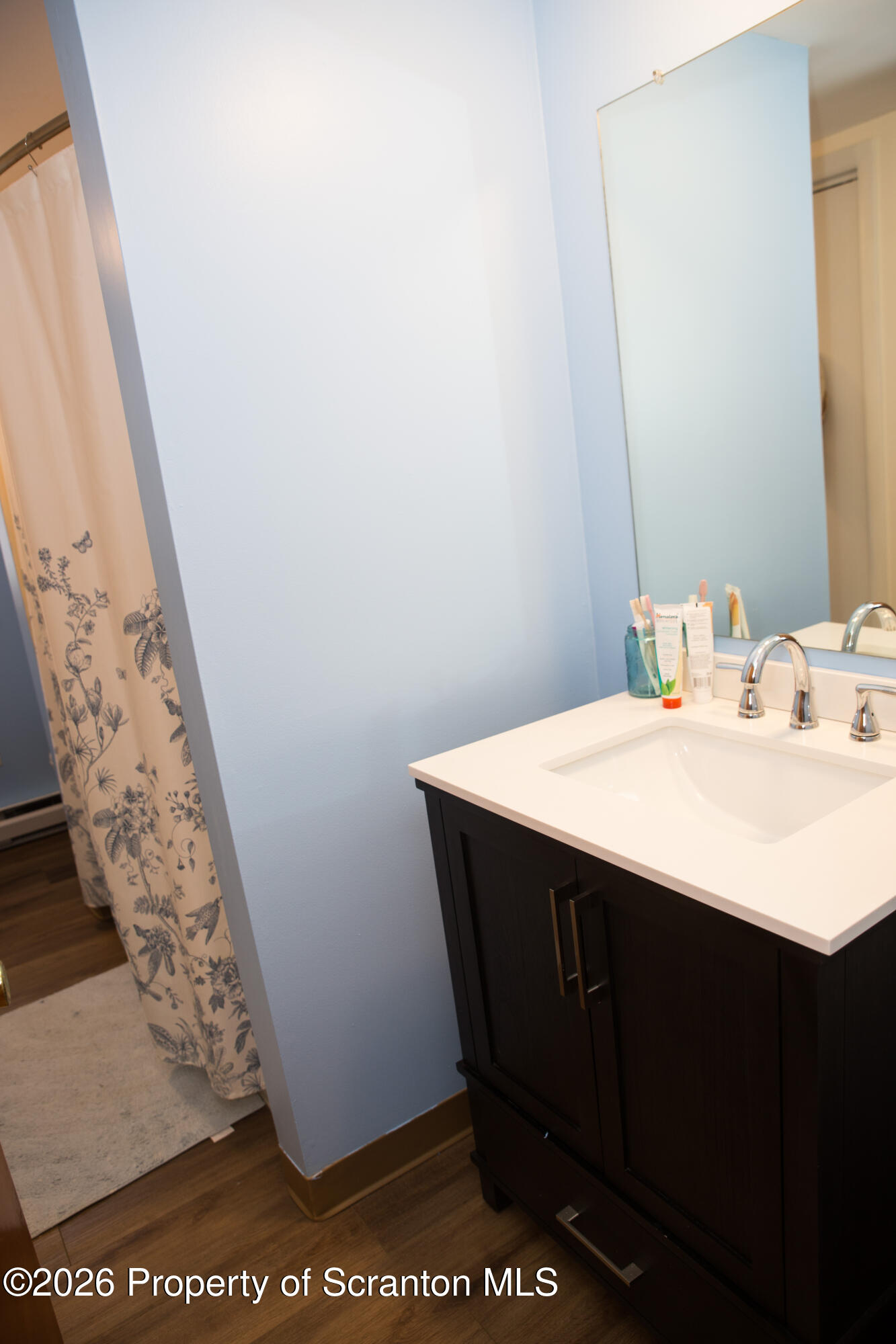 5411 Bloomington Road Moscow, PA 18444 - Photo 6 of 7 a bathroom with a sink and a mirror