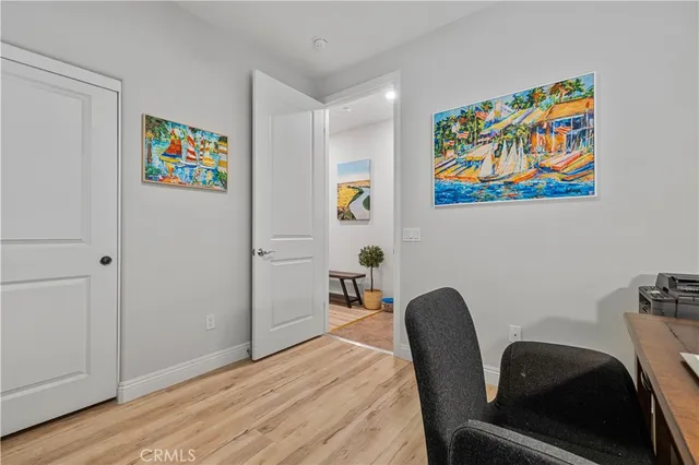 a workspace with furniture and painting on the wall