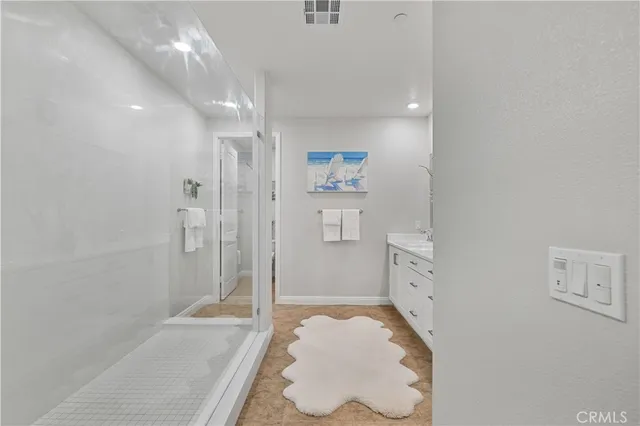 a bathroom with a tub and shower