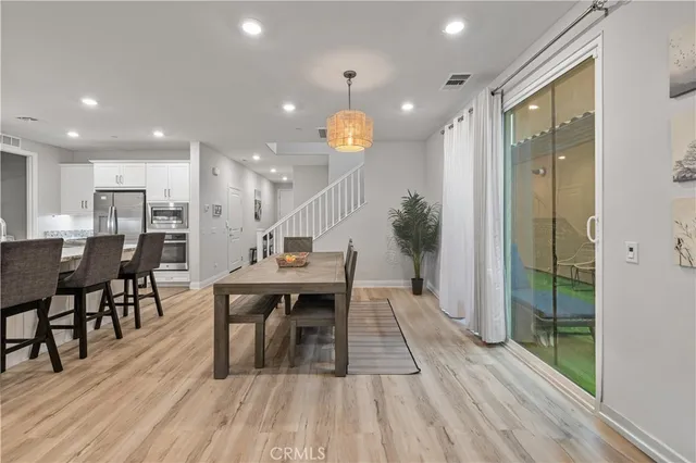 a kitchen with a table and chairs in it