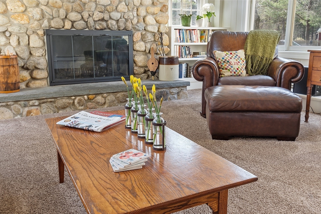 551 Barretts Mill Road Concord, MA 01742 - Photo 11 of 36 a living room with furniture and a table