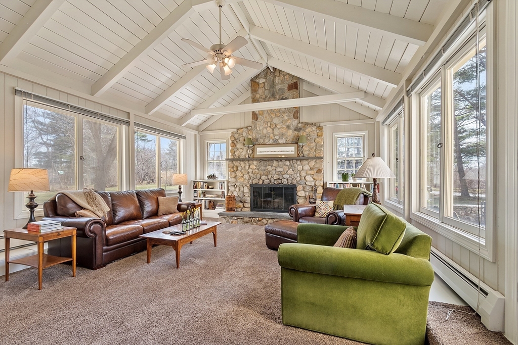551 Barretts Mill Road Concord, MA 01742 - Photo 12 of 36 a living room with furniture ceiling fan and a large window