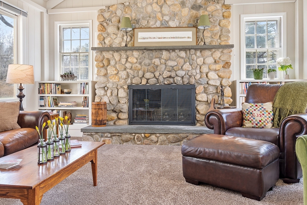 551 Barretts Mill Road Concord, MA 01742 - Photo 13 of 36 a living room with furniture and a fireplace