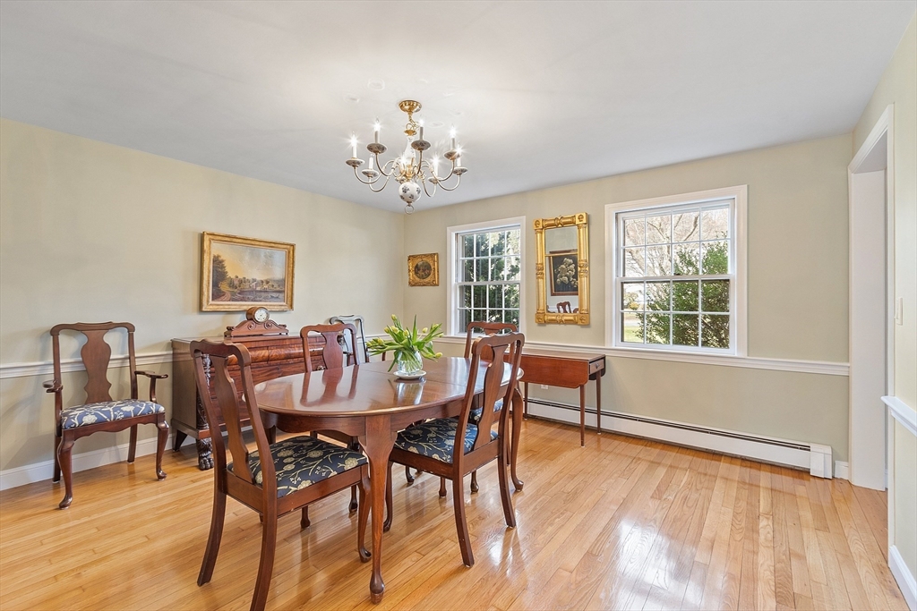 551 Barretts Mill Road Concord, MA 01742 - Photo 14 of 36 a view of a dining room with furniture window and wooden floor