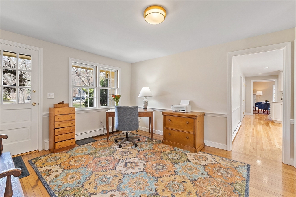 551 Barretts Mill Road Concord, MA 01742 - Photo 16 of 36 a bedroom with a bed and wooden floor