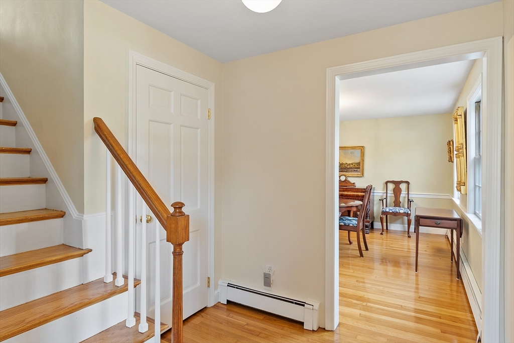 551 Barretts Mill Road Concord, MA 01742 - Photo 20 of 36 a view of a hallway with wooden floor and staircase
