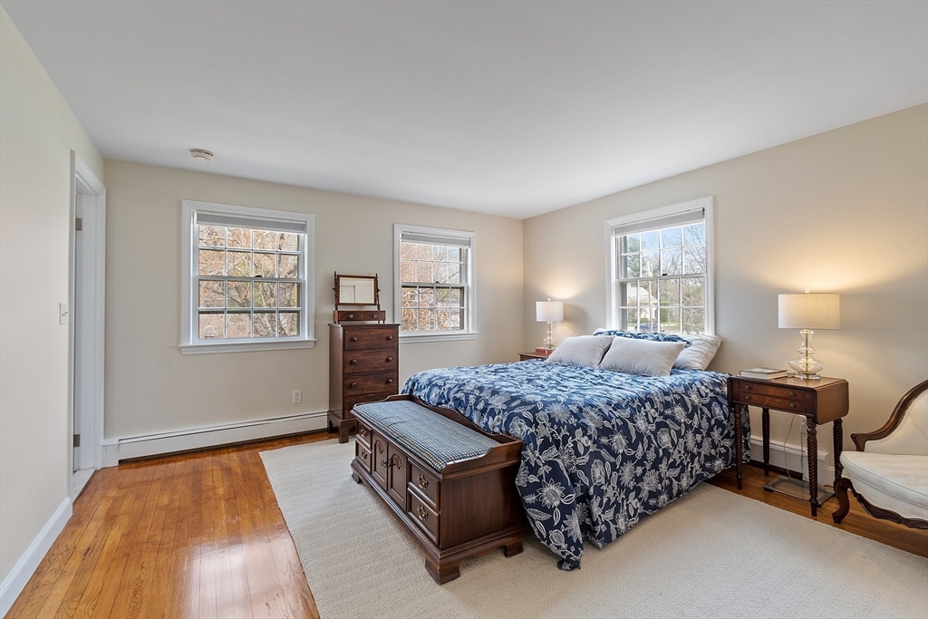 551 Barretts Mill Road Concord, MA 01742 - Photo 21 of 36 a bedroom with a bed window and a dresser