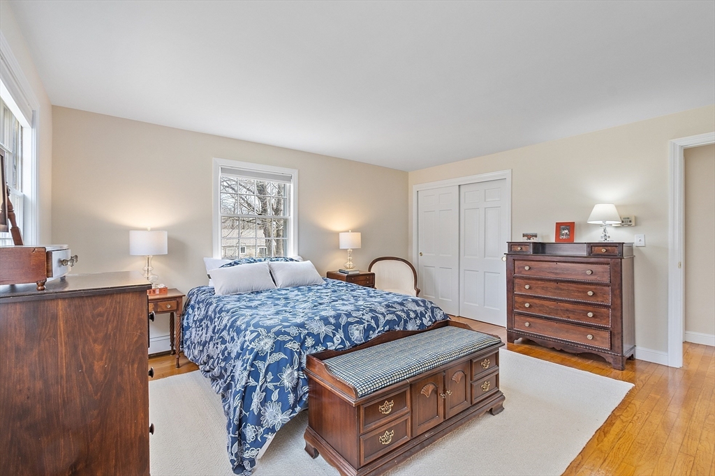 551 Barretts Mill Road Concord, MA 01742 - Photo 22 of 36 a bed room with a bed and dresser