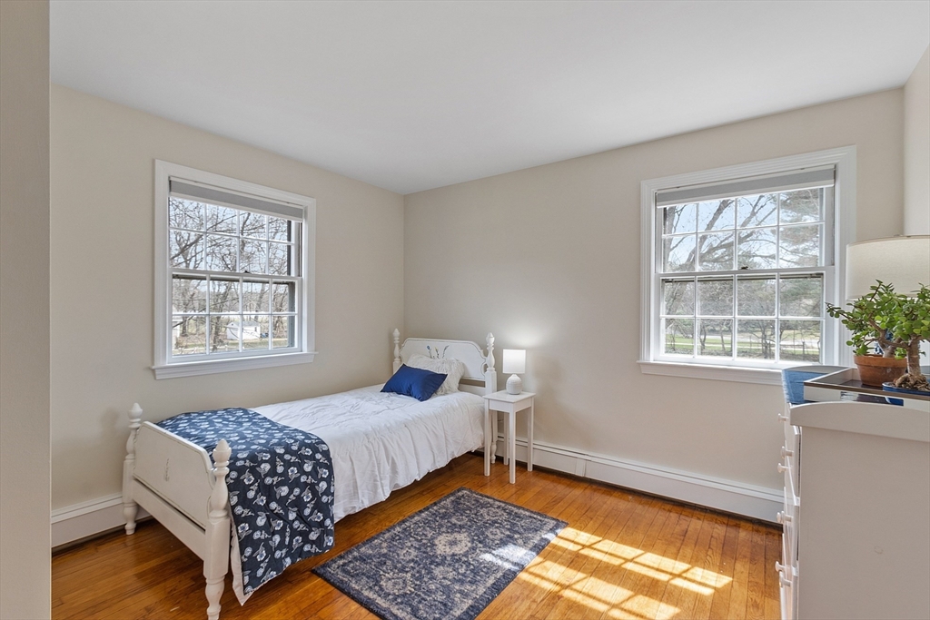 551 Barretts Mill Road Concord, MA 01742 - Photo 26 of 36 a bedroom with bed and window