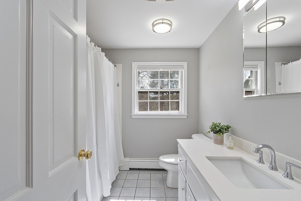551 Barretts Mill Road Concord, MA 01742 - Photo 27 of 36 a bathroom with a sink a toilet and shower
