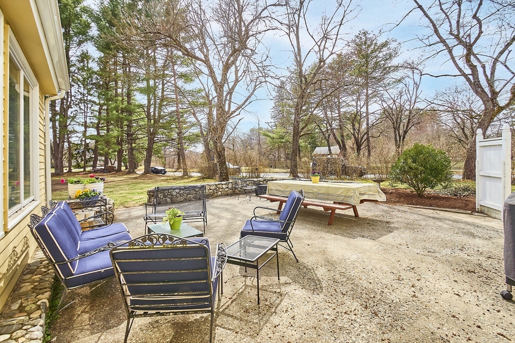 551 Barretts Mill Road Concord, MA 01742 - Photo 3 of 36 a view of a lounge chairs in a patio of the house