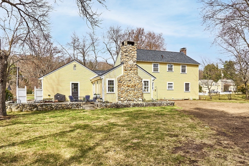551 Barretts Mill Road Concord, MA 01742 - Photo 33 of 36 a view of a house with a yard
