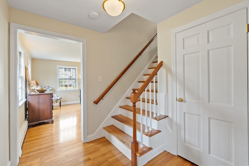 551 Barretts Mill Road Concord, MA 01742 - Photo 4 of 36 a view of entryway and hall with wooden floor
