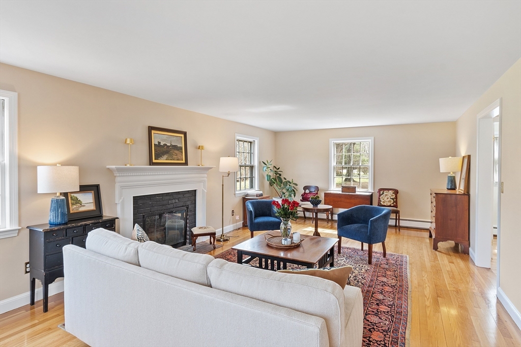 551 Barretts Mill Road Concord, MA 01742 - Photo 6 of 36 a living room with furniture and a fireplace