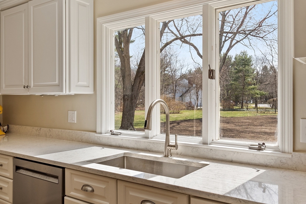 551 Barretts Mill Road Concord, MA 01742 - Photo 7 of 36 a kitchen with a sink and a window