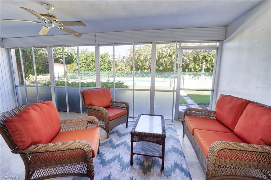 820 Ketch Drive, Unit 3 Naples, FL 34103 - Photo 1 of 19 a blue room with furniture and a large window
