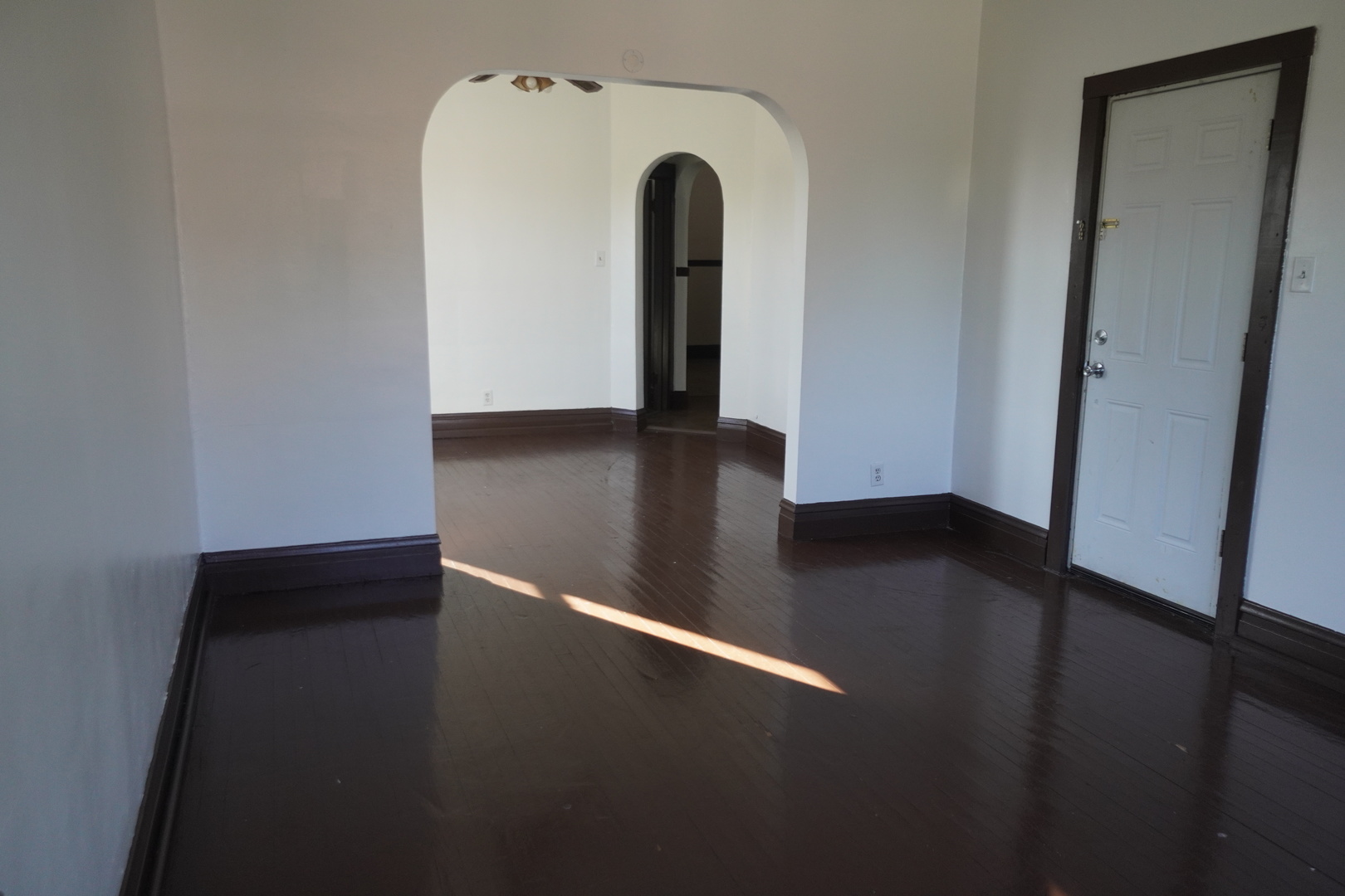 1170 Connecticut Street, Unit 2 Gary, IN 46407 - Photo 2 of 9 a view of a hardwood floor in a hall