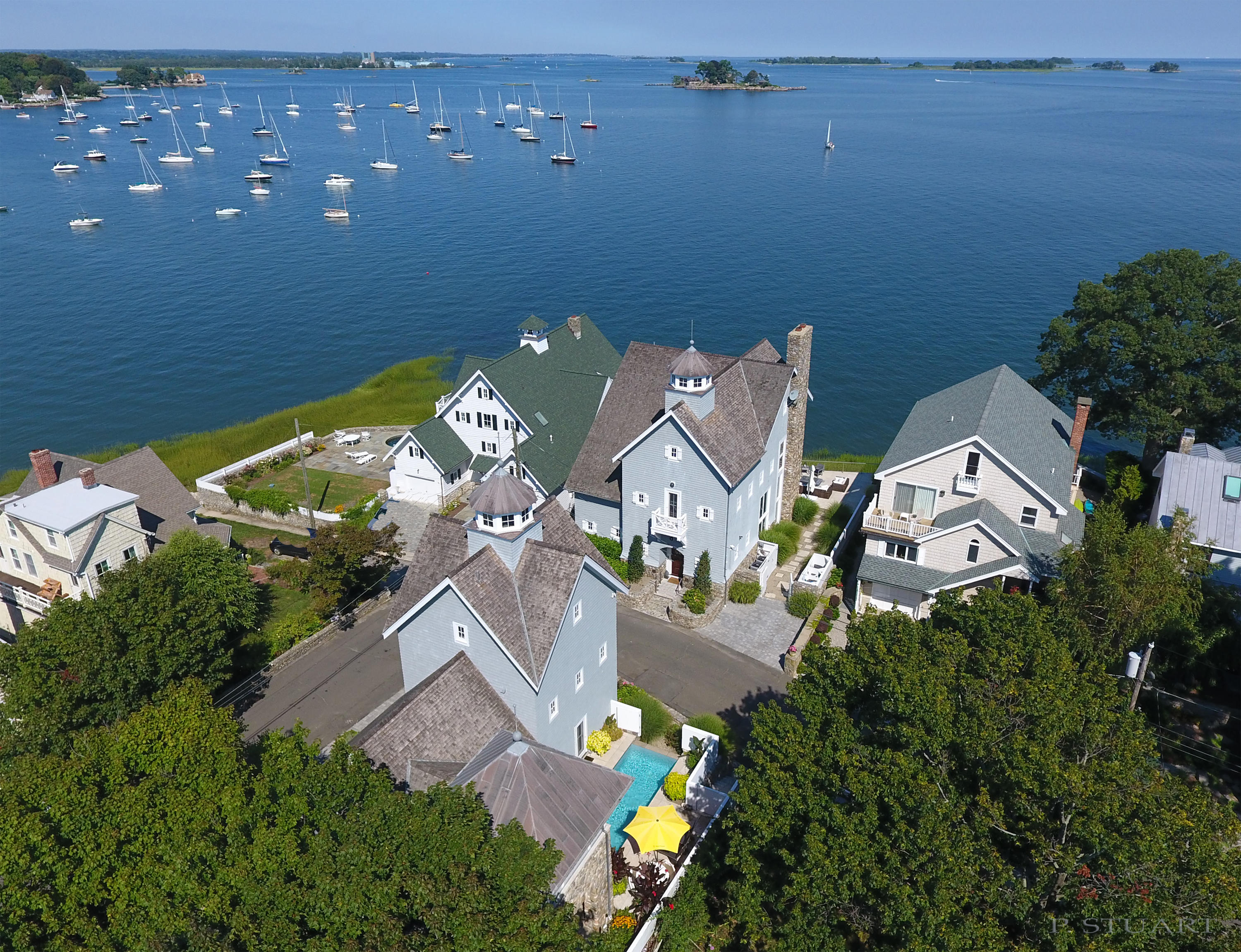 an aerial view of residential house with outdoor space and swimming pool
