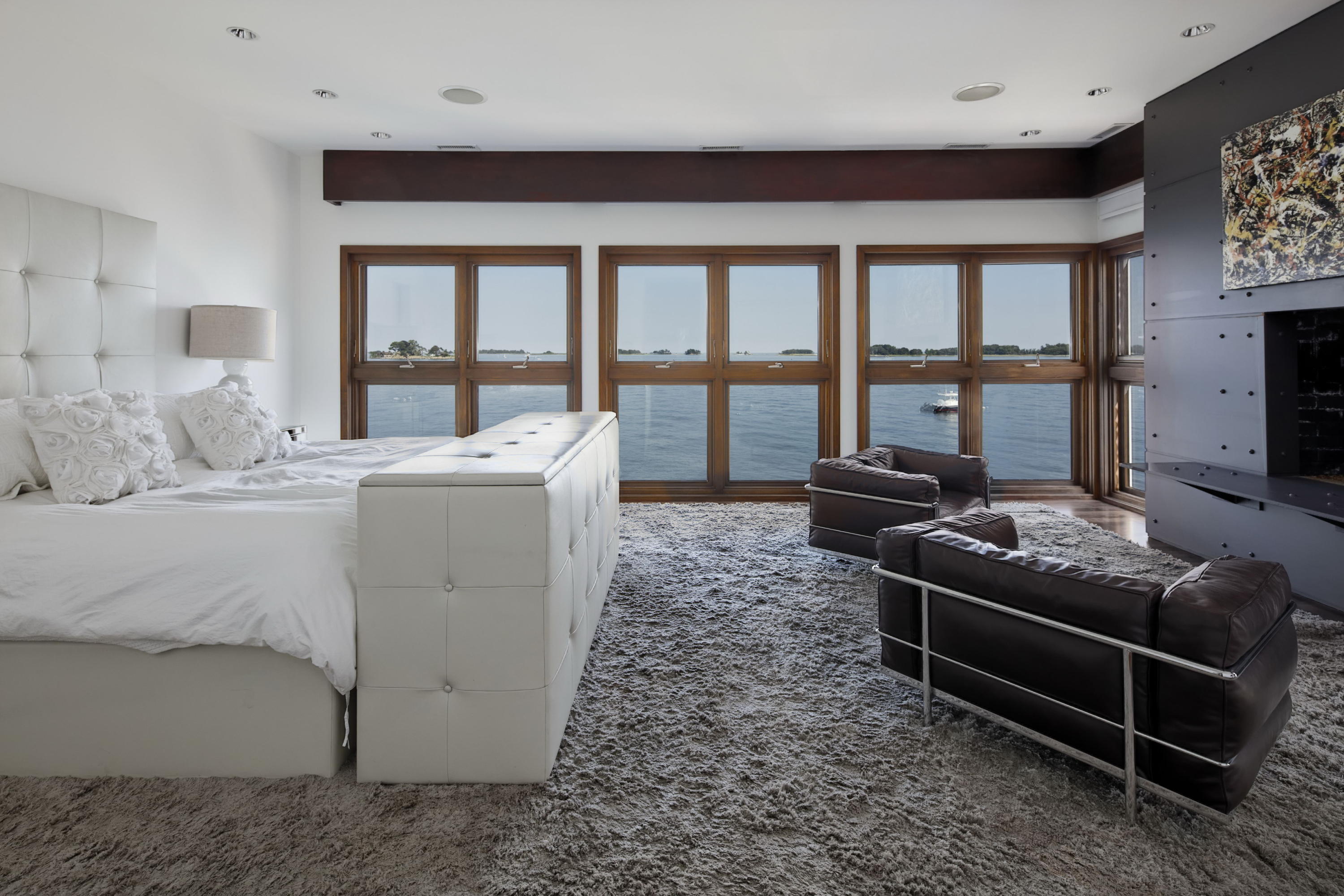 1-2 Rocky Point Road Rowayton, CT 06853 - Photo 14 of 35 a living room with furniture and a floor to ceiling window