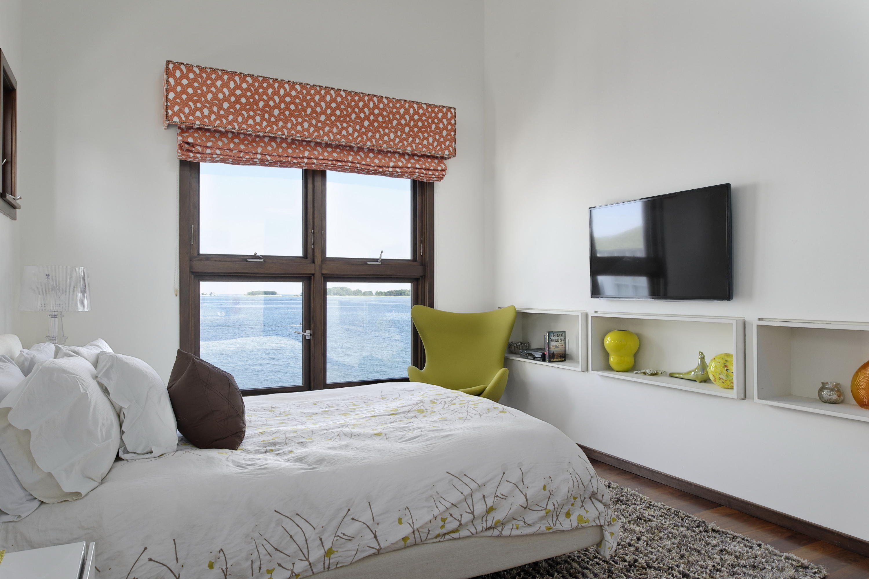 1-2 Rocky Point Road Rowayton, CT 06853 - Photo 16 of 35 a bedroom with a bed and tv on the dresser