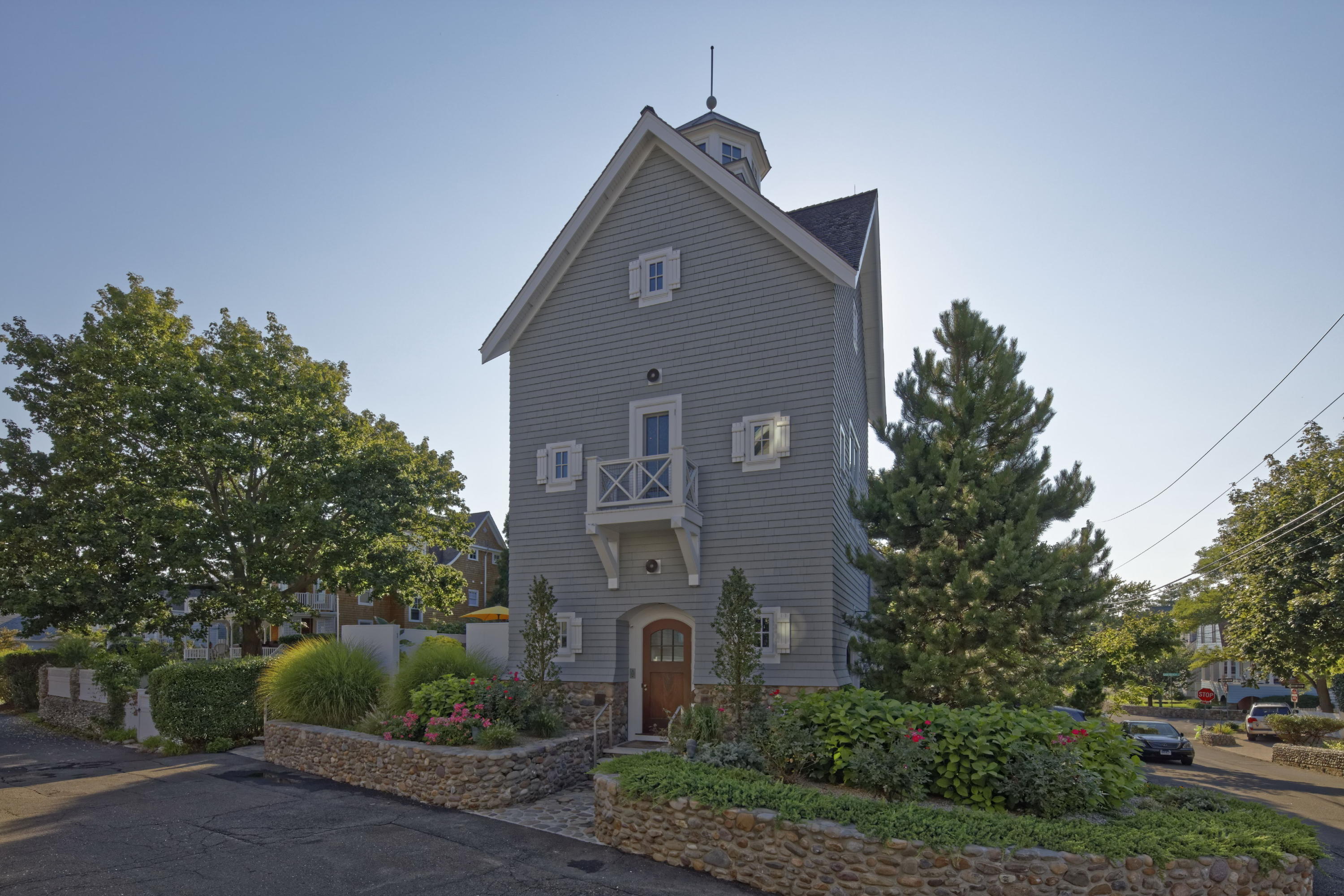 1-2 Rocky Point Road Rowayton, CT 06853 - Photo 20 of 35 a front view of a house with garden