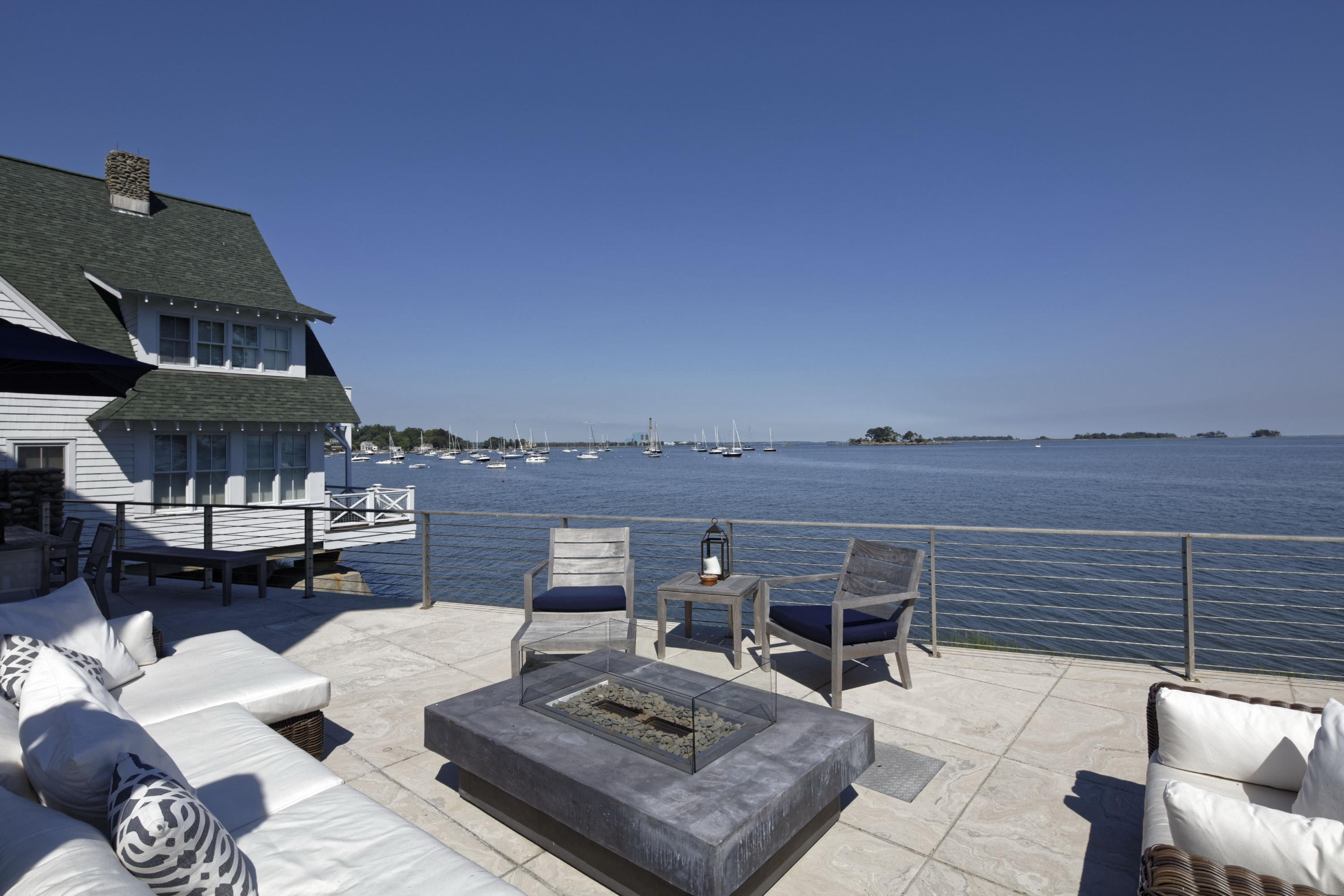 1-2 Rocky Point Road Rowayton, CT 06853 - Photo 2 of 35 a view of a terrace with couches