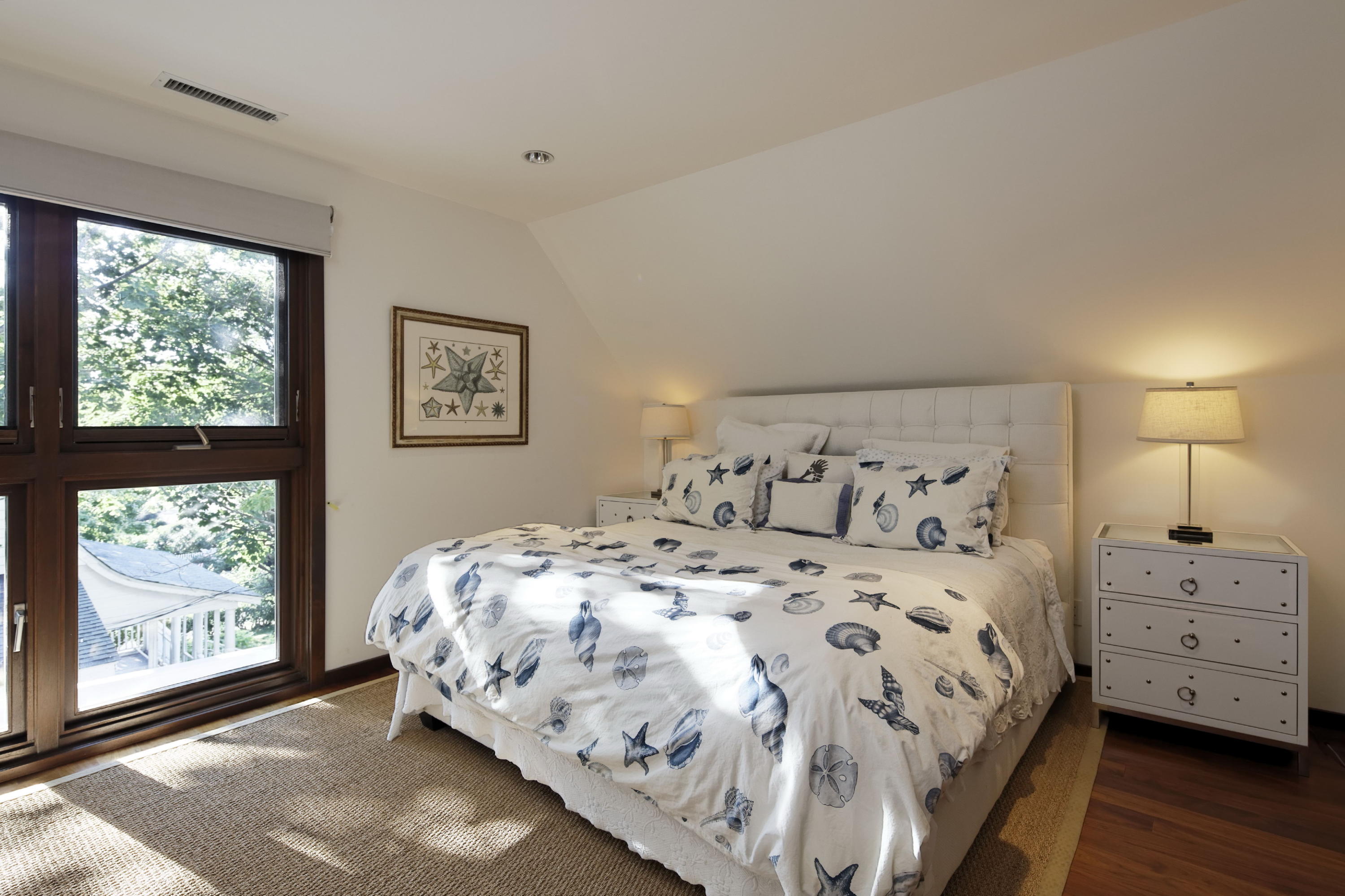 1-2 Rocky Point Road Rowayton, CT 06853 - Photo 22 of 35 a bedroom with a bed and window