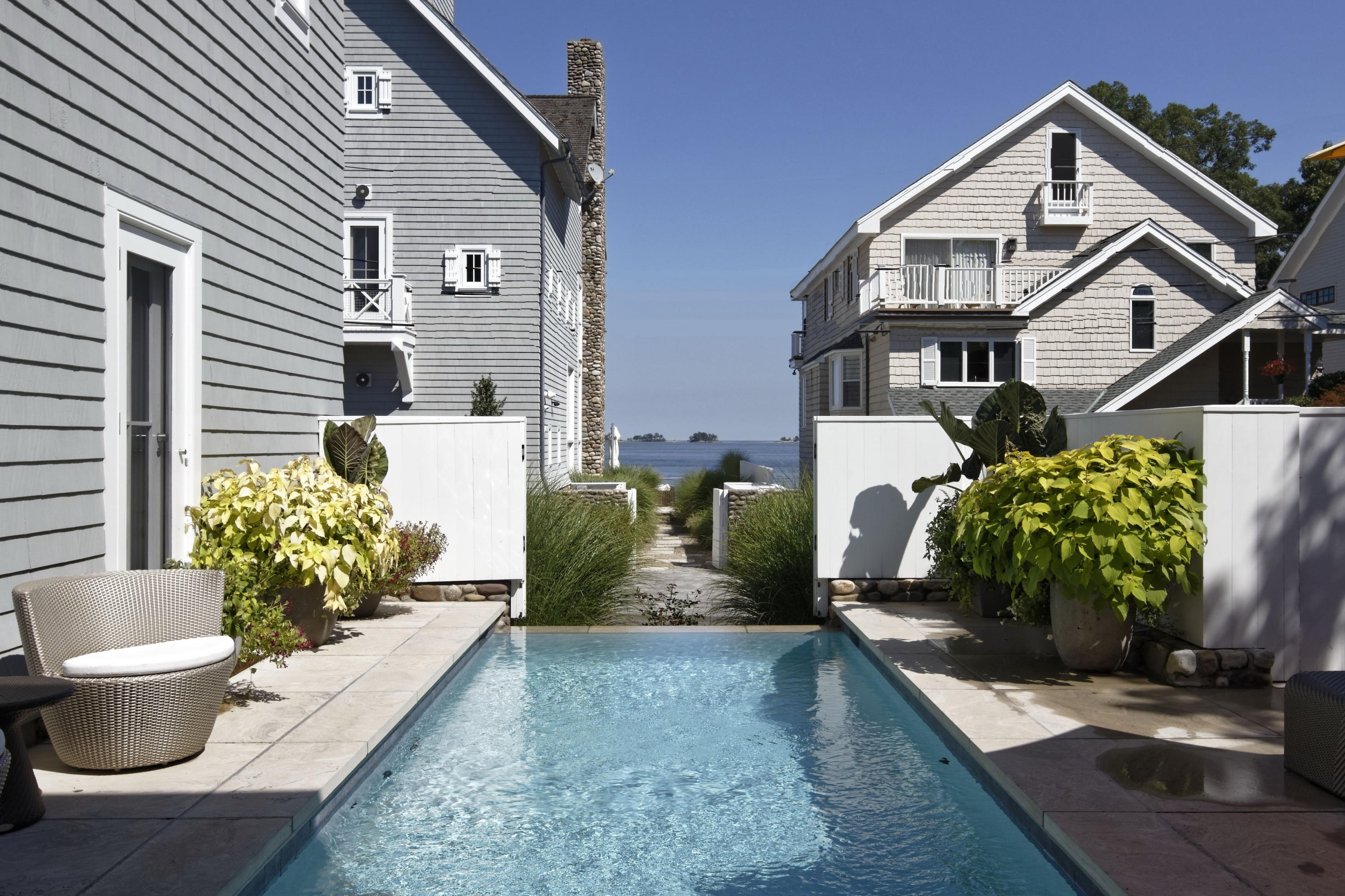 1-2 Rocky Point Road Rowayton, CT 06853 - Photo 6 of 35 a view of a house with potted plants