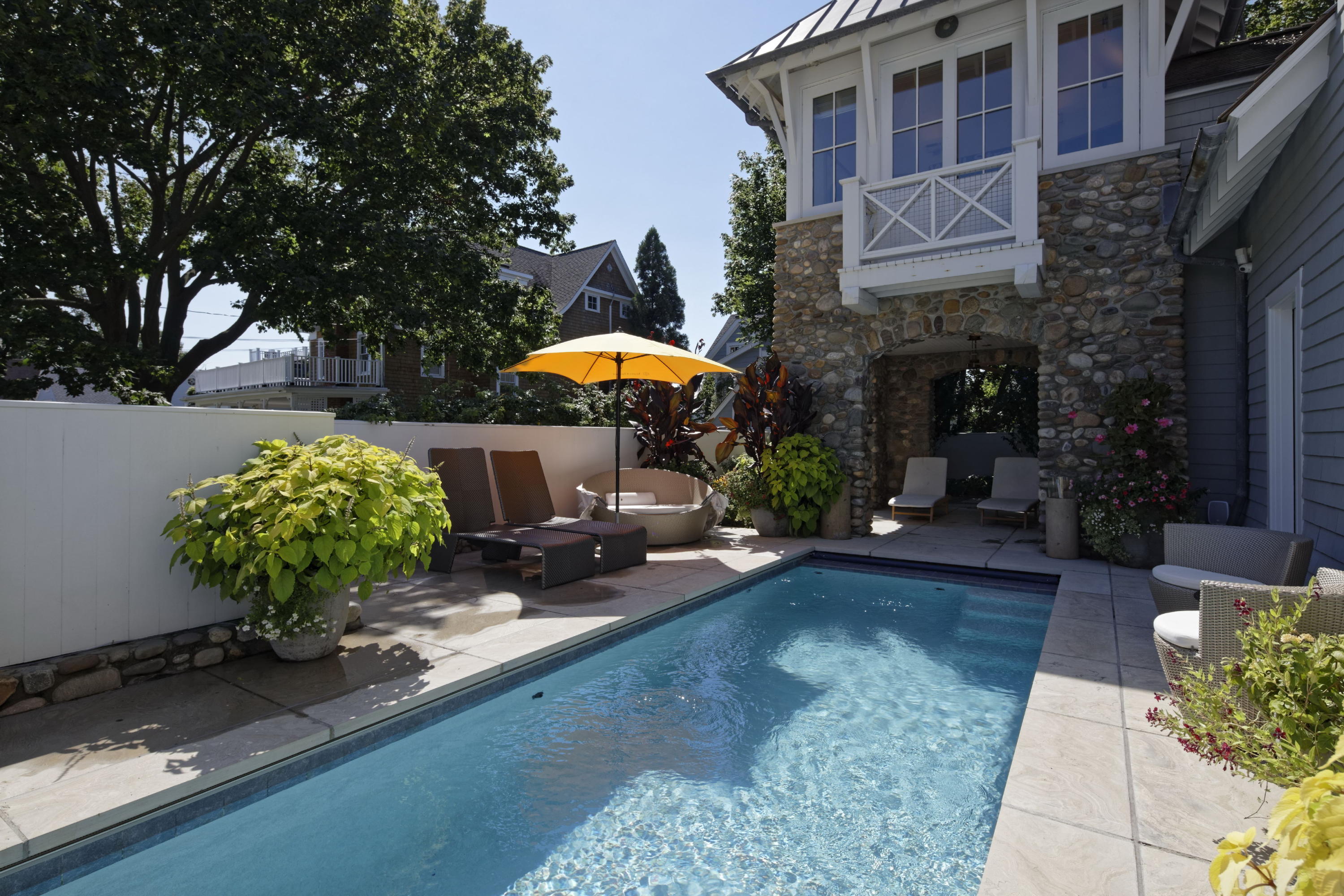 1-2 Rocky Point Road Rowayton, CT 06853 - Photo 7 of 35 a front view of a house with yard and sitting area
