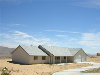 26174 Outpost Road Apple Valley, CA 92308 - Photo 1 of 1 a house with a outdoor space