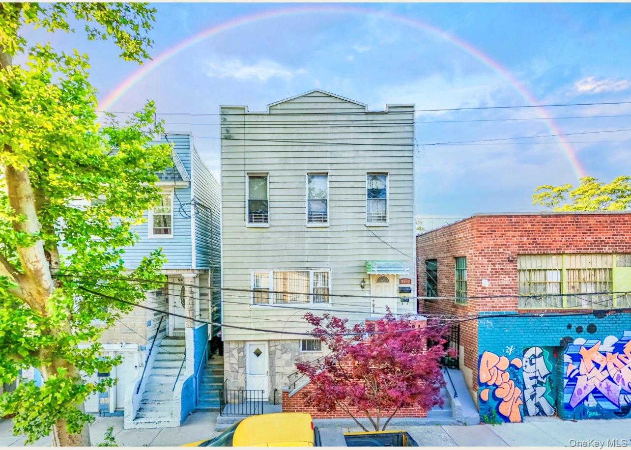 58-83 57th Road Queens, NY 11378 - Photo 1 of 1 a front view of a house